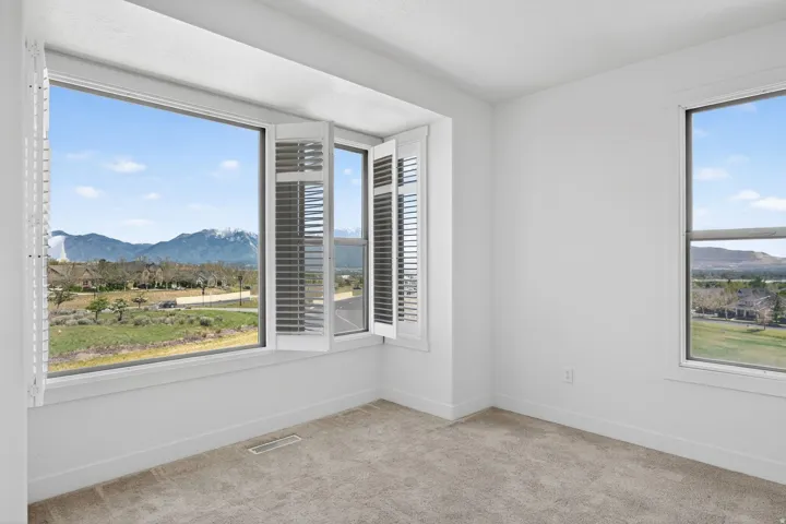 Expansive window offering distant mountain scenery