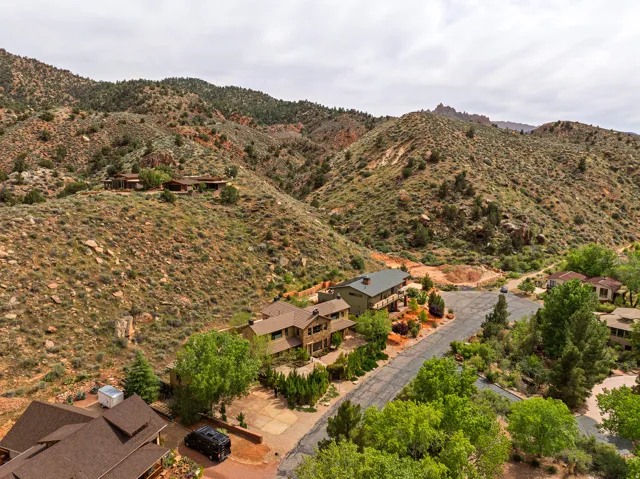 Expansive residential area nestled among arid mountains and natural rock formations
