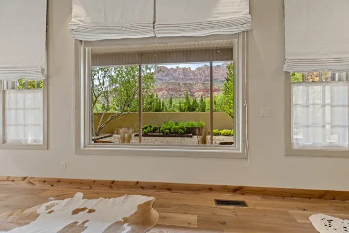 Large picture window with custom Roman shades