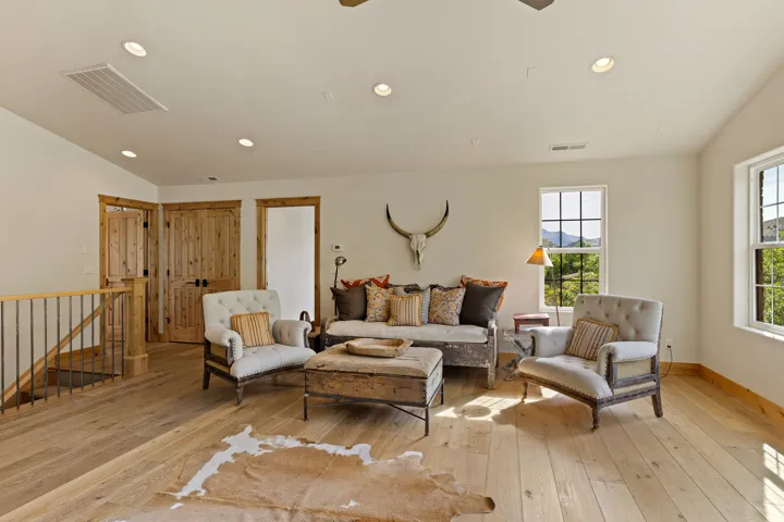 Open living area with light wood-finish flooring