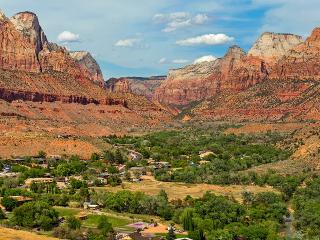 Expansive landscape featuring towering red rock formations