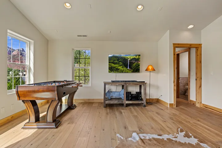 Bright interior space featuring light wood-finish flooring, recessed lighting, and white walls