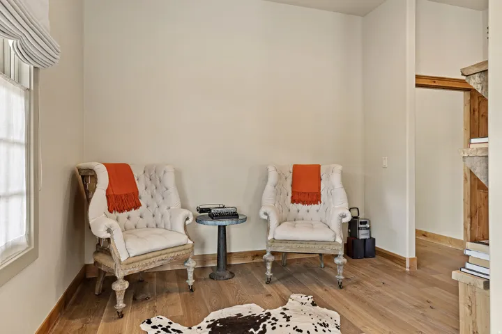 Light wood-finish flooring with coordinating baseboards