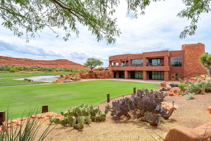 Terracotta-hued desert modern structure with a multi-level design