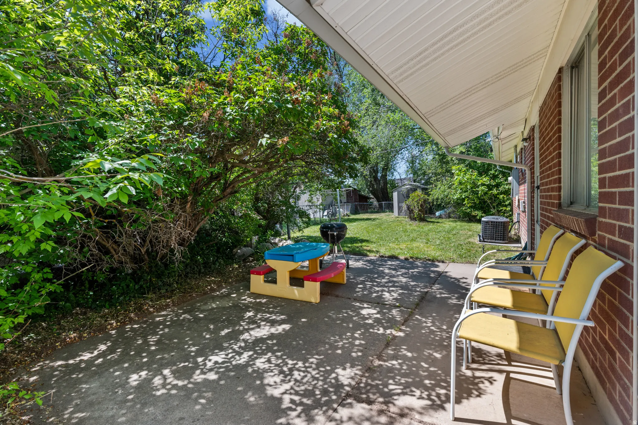 Covered patio area featuring a concrete surface