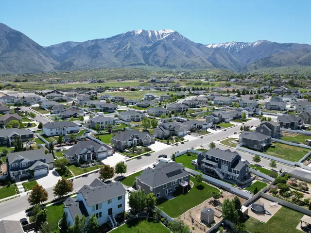 Expansive residential development featuring numerous single-family homes with pitched roofs and manicured lawns