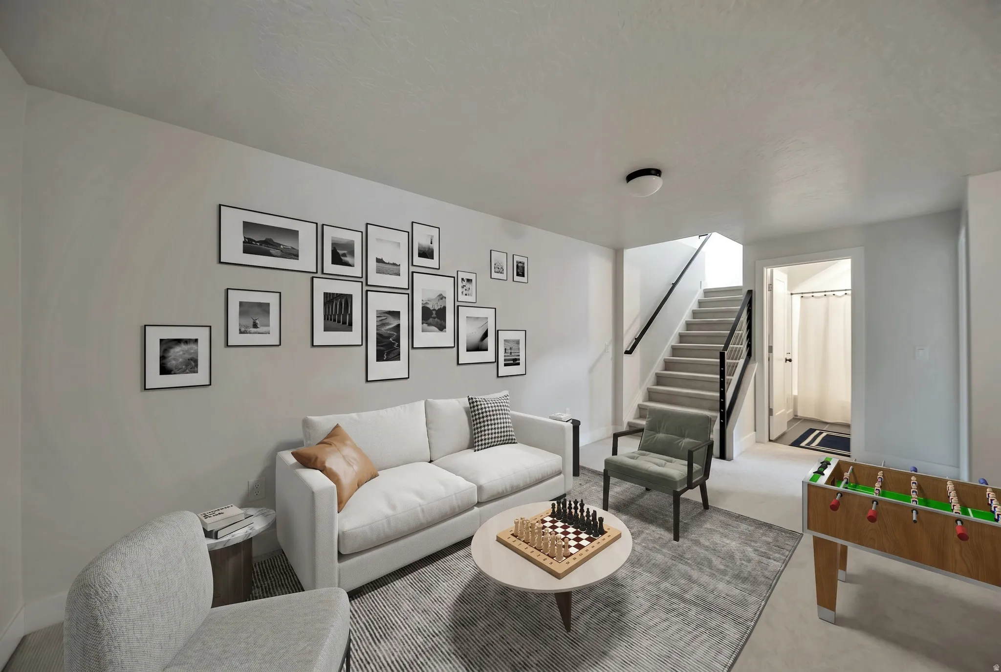 Spacious lower-level area featuring light gray wall paint and recessed ceiling lighting