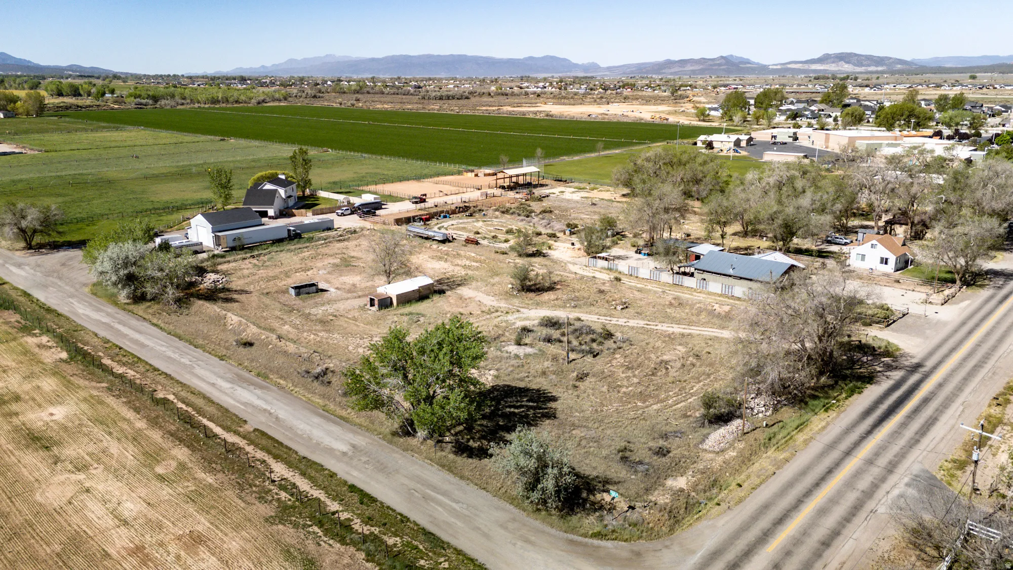 Expansive corner lot with two structures and mature trees