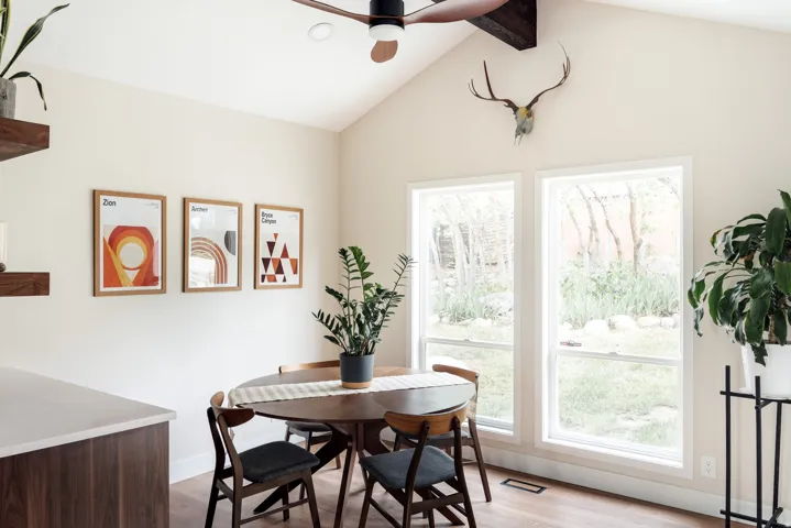Vaulted ceiling with exposed wood beam and ceiling fan