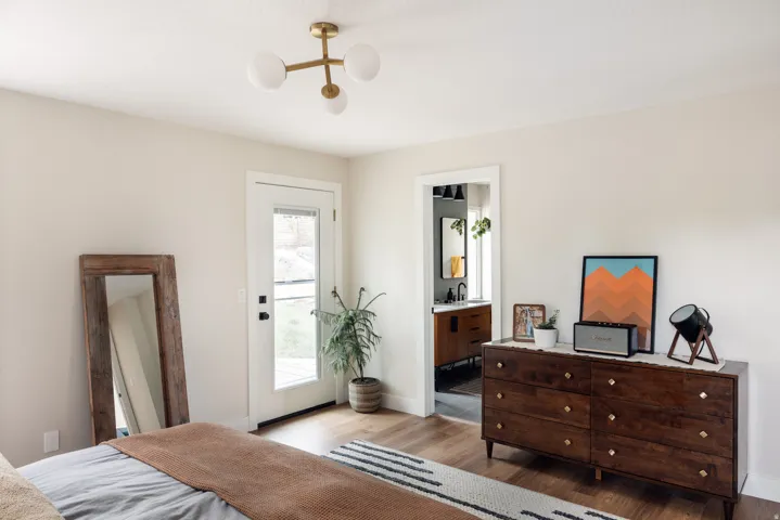 Light-colored walls with an entryway leading to an outdoor area