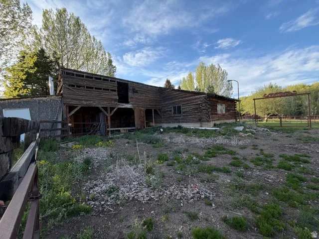 Rustic log barn with a secondary structure