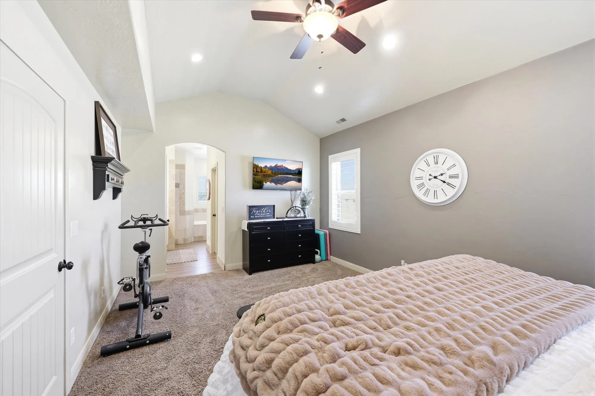 PRIMARY Vaulted ceiling bedroom featuring plush carpeting, recessed lighting, and a ceiling fan