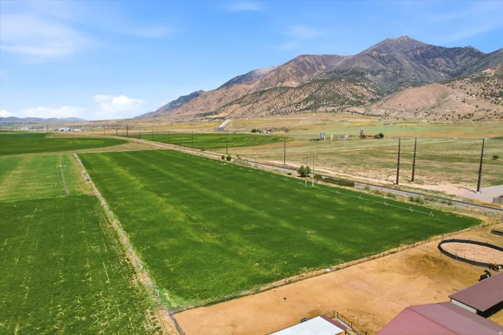 ADDITIONAL LAND AVAILABLE SEPARATELY Expansive agricultural fields with distant mountains under a clear sky