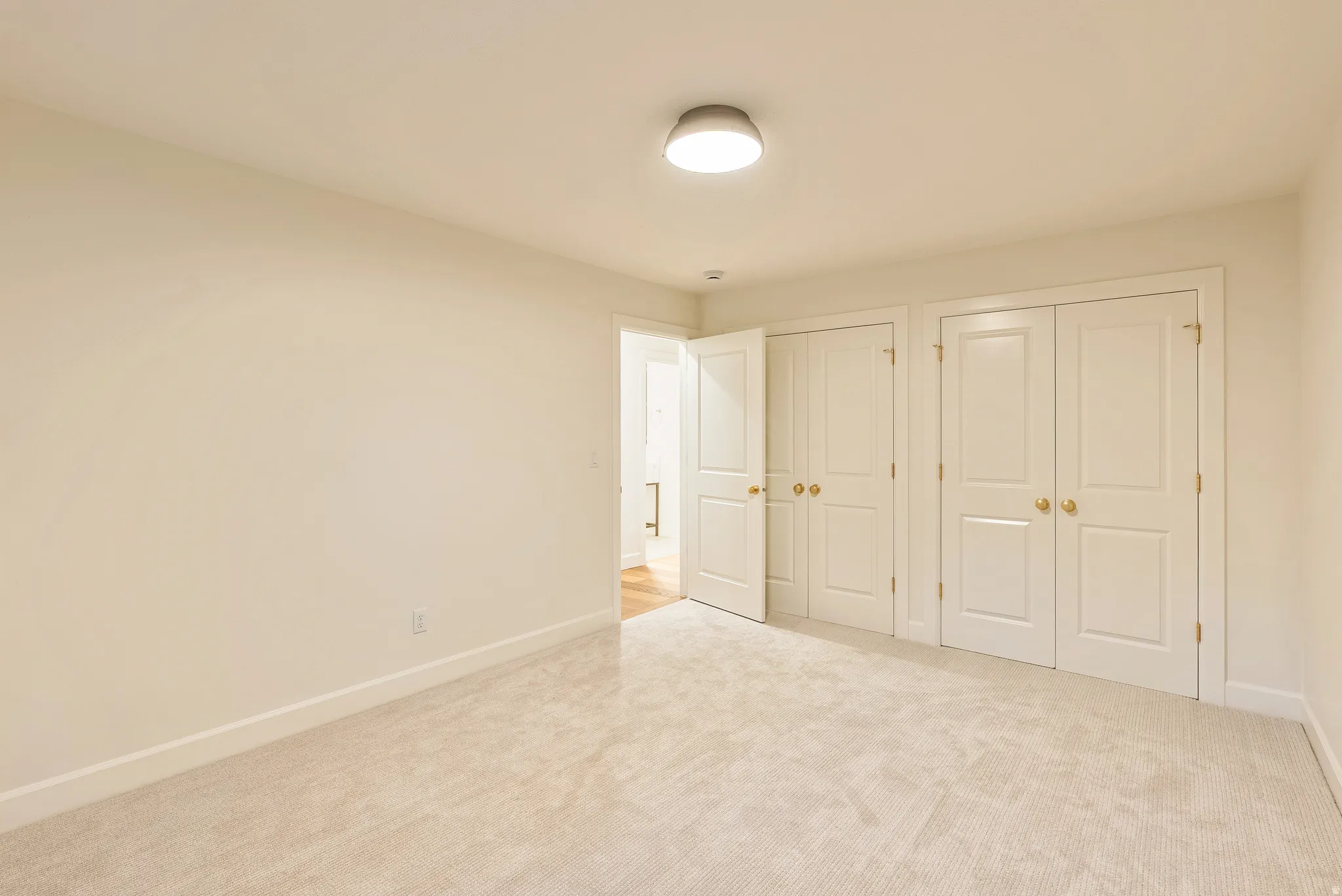 Neutral-toned carpeting throughout
