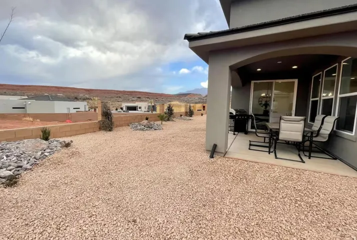 Covered patio with recessed lighting and a sliding glass door