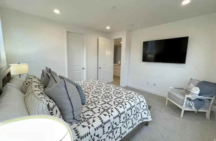 Bedroom featuring neutral wall paint, recessed lighting, and soft carpet flooring