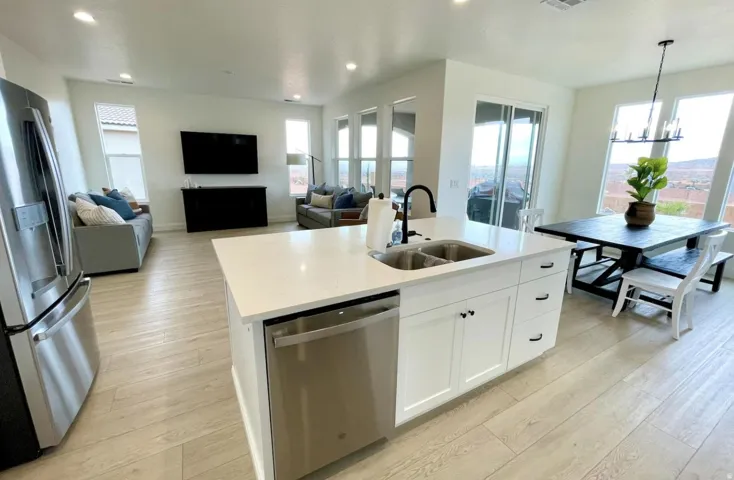 Open-concept living area featuring light wood-finish flooring throughout