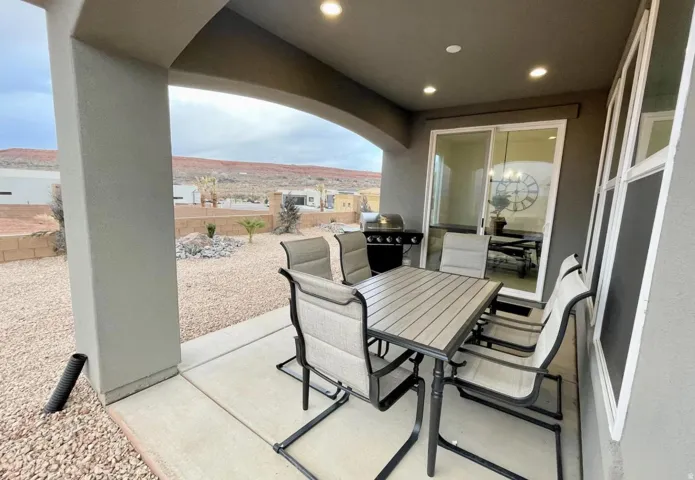 Covered patio with recessed lighting, concrete flooring, and sliding glass door access