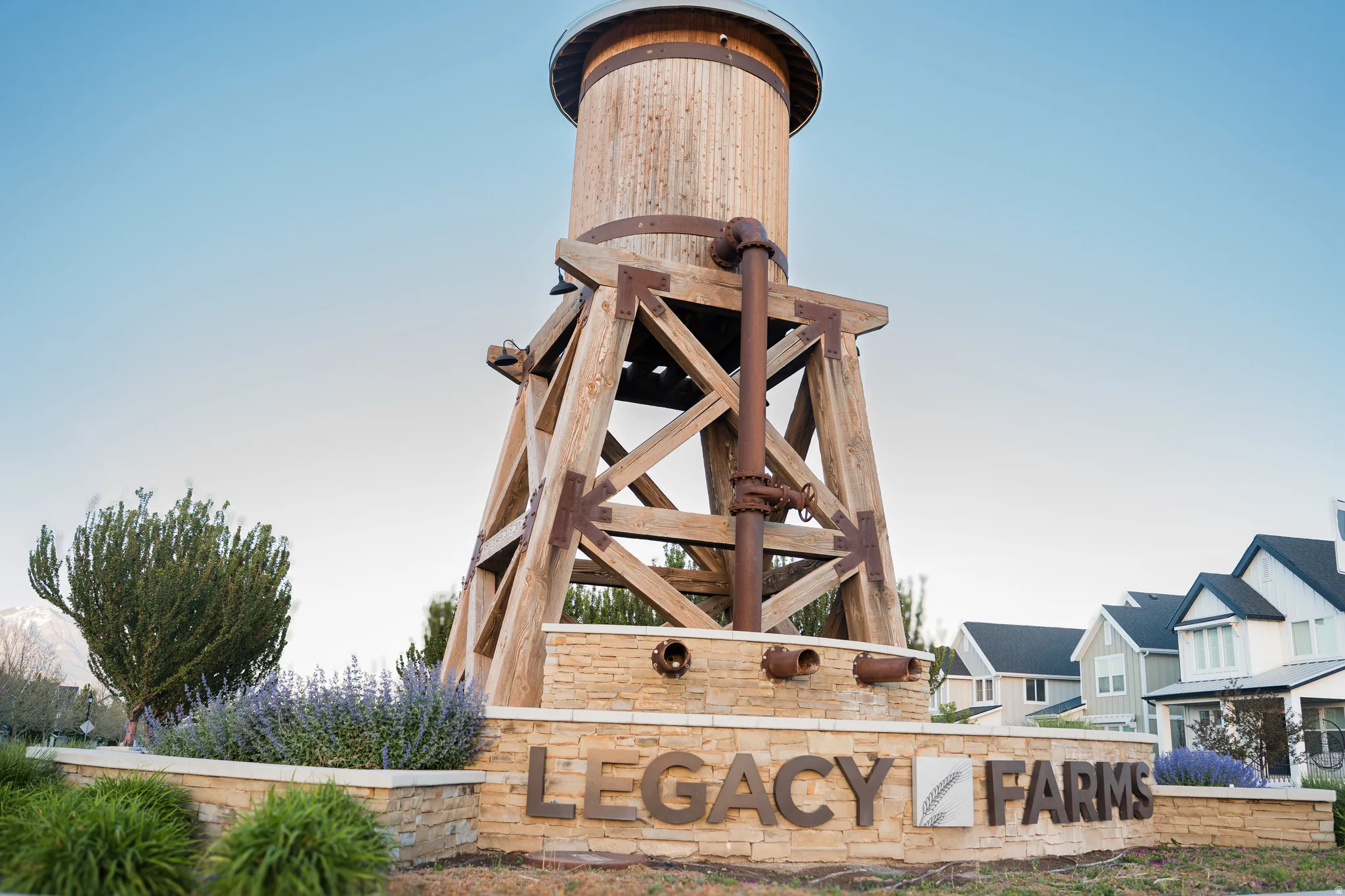 Legacy Farms entry monument featuring a wooden water tower structure