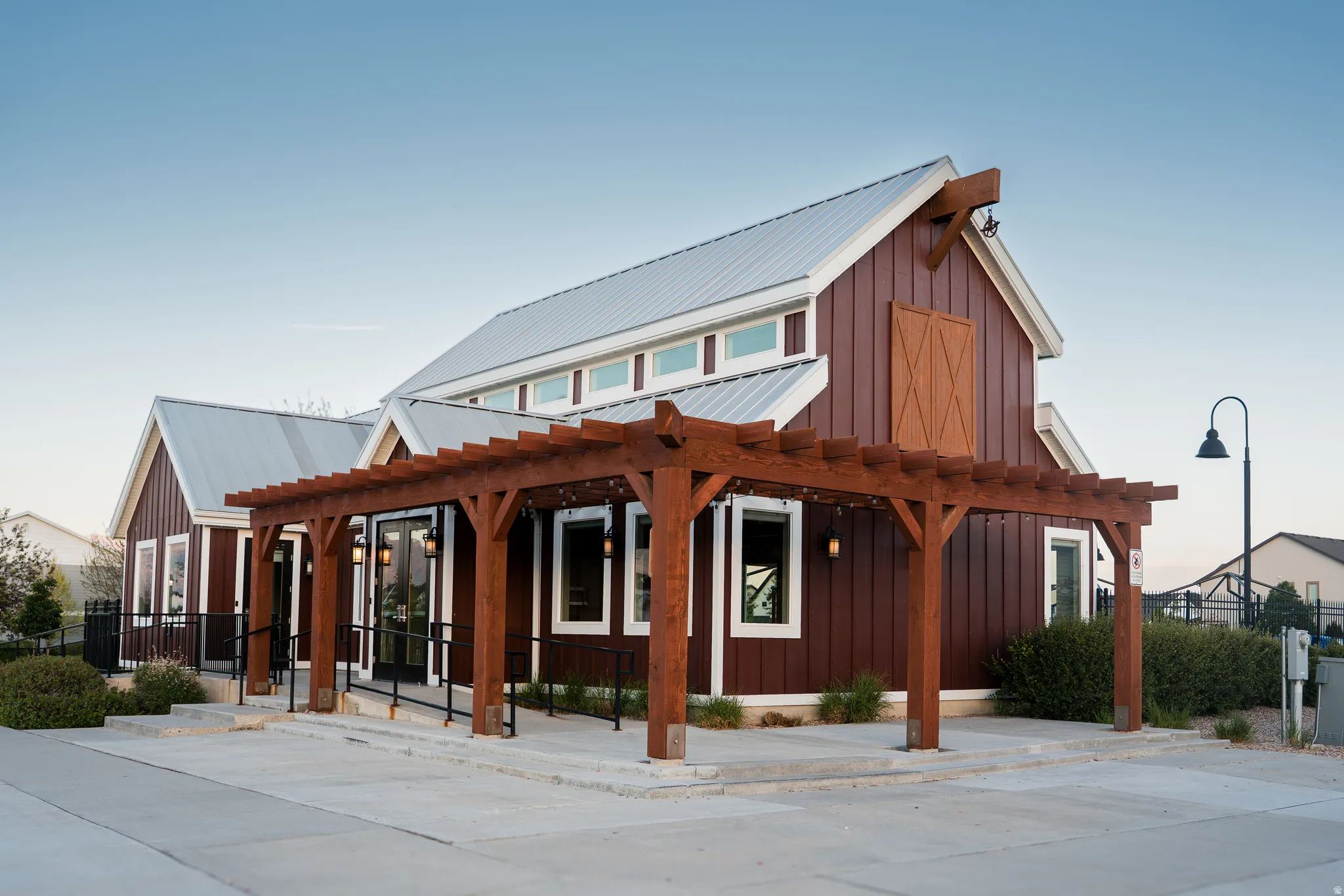 Barn-style exterior featuring vertical wood siding and white trim