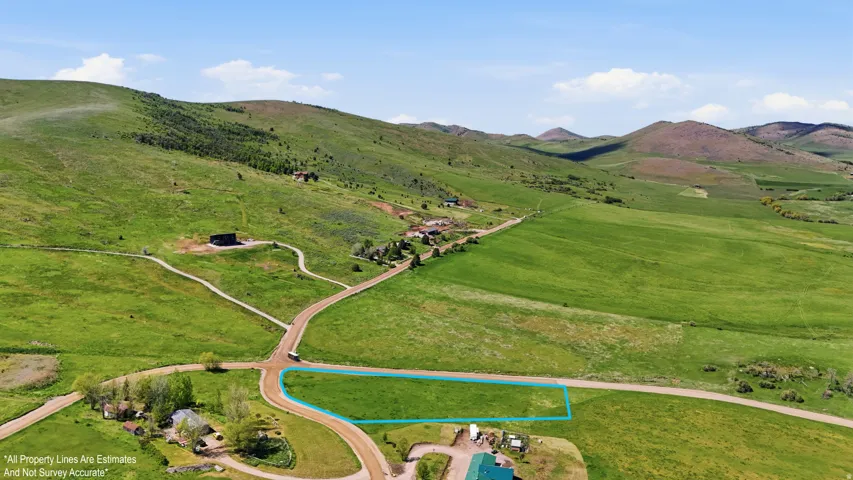 Expansive green landscape featuring rolling hill- boundary line for a visual only