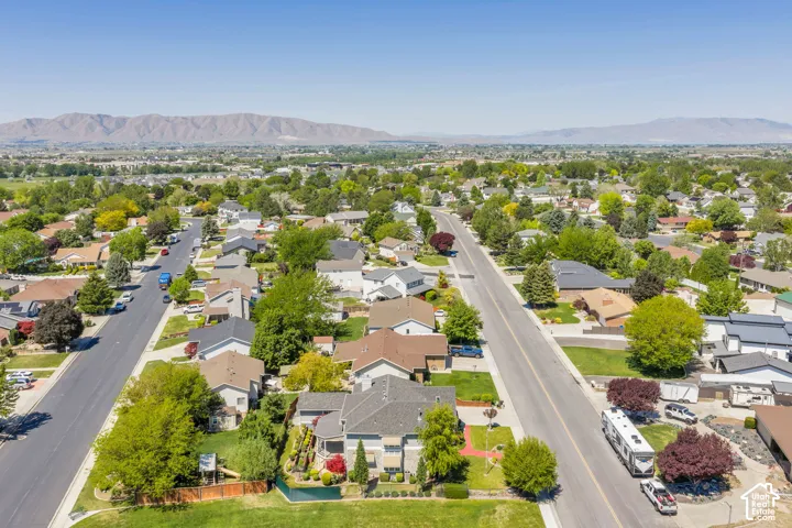 Established neighborhood featuring mature landscaping, wide streets, and a mountainous backdrop