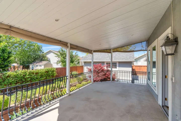 Covered patio featuring concrete flooring and a white paneled ceiling with recessed lighting