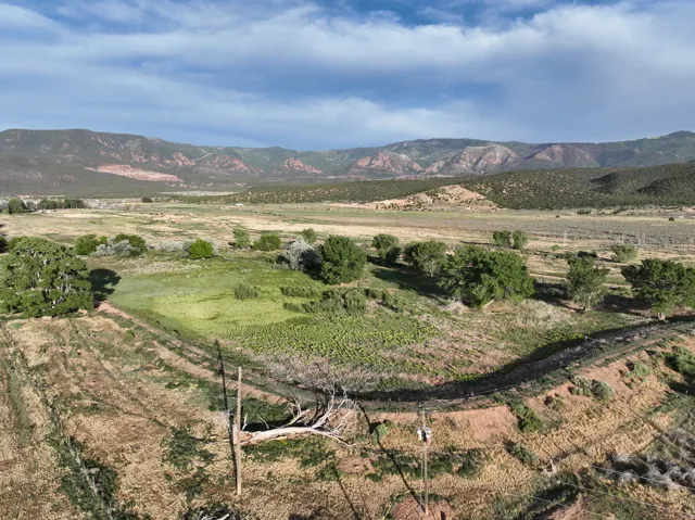 View of mountain background featuring rural landscape