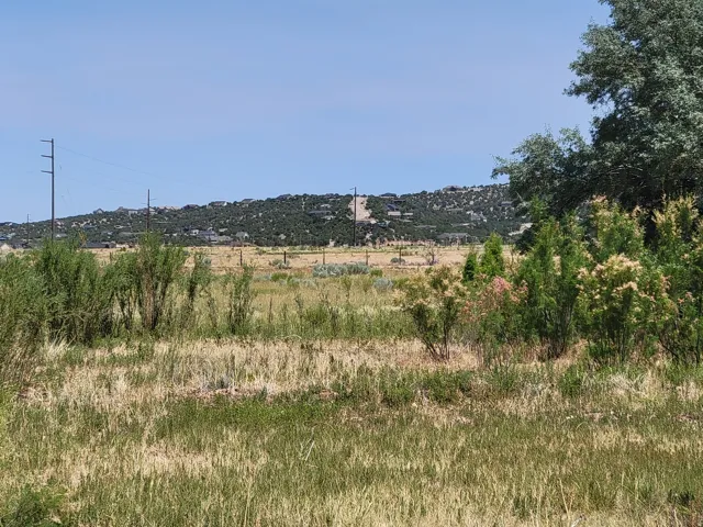 View of mountain background featuring rural landscape