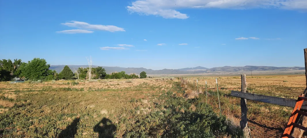 View of mountain background featuring rural landscape