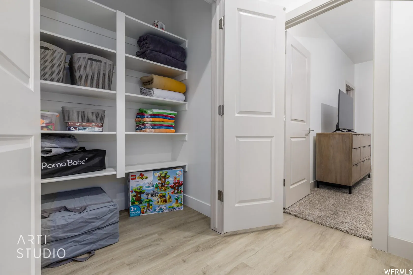 Built-in shelving unit featuring multiple storage shelves