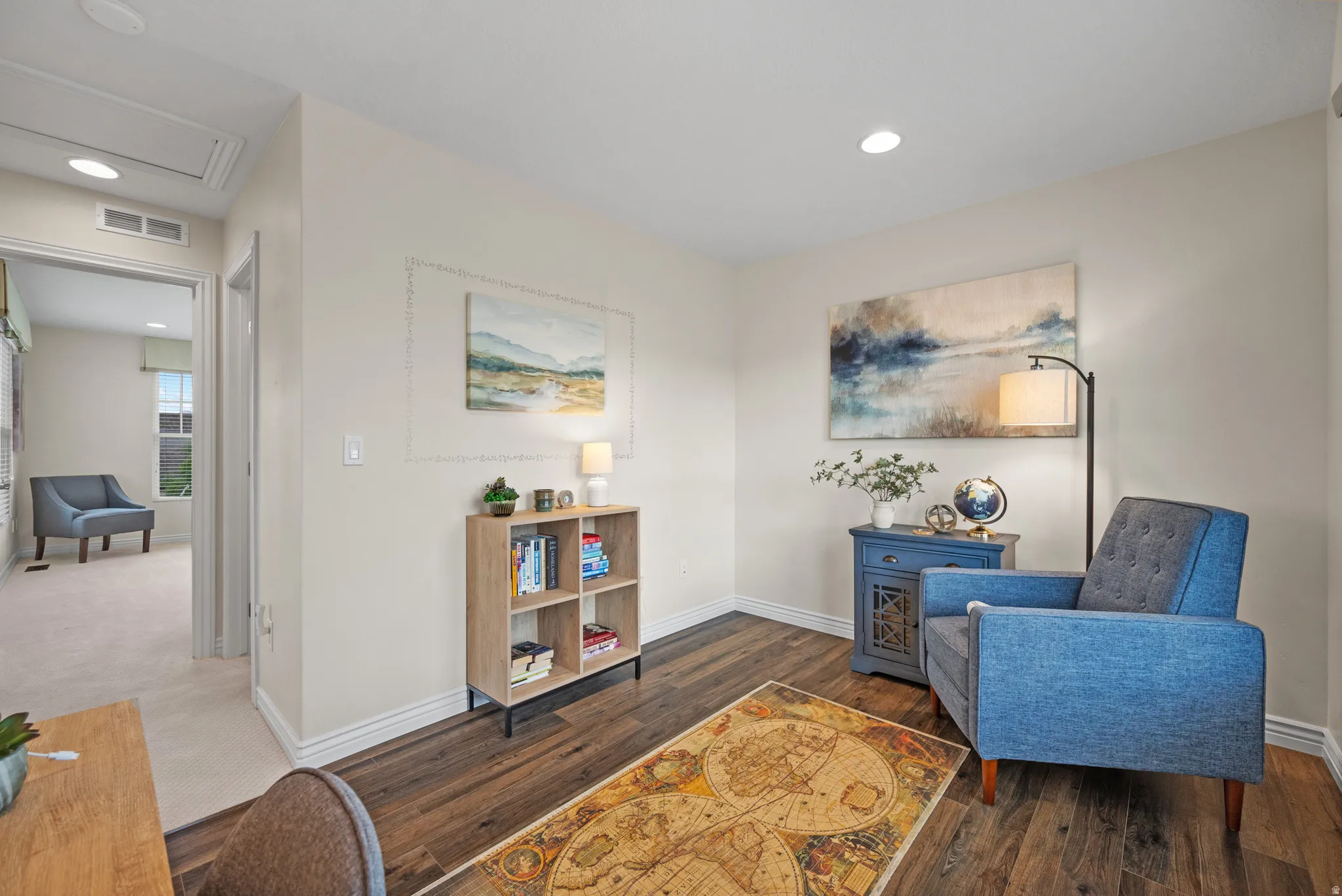 Versatile interior space featuring wood-finish flooring, recessed lighting, and white baseboards