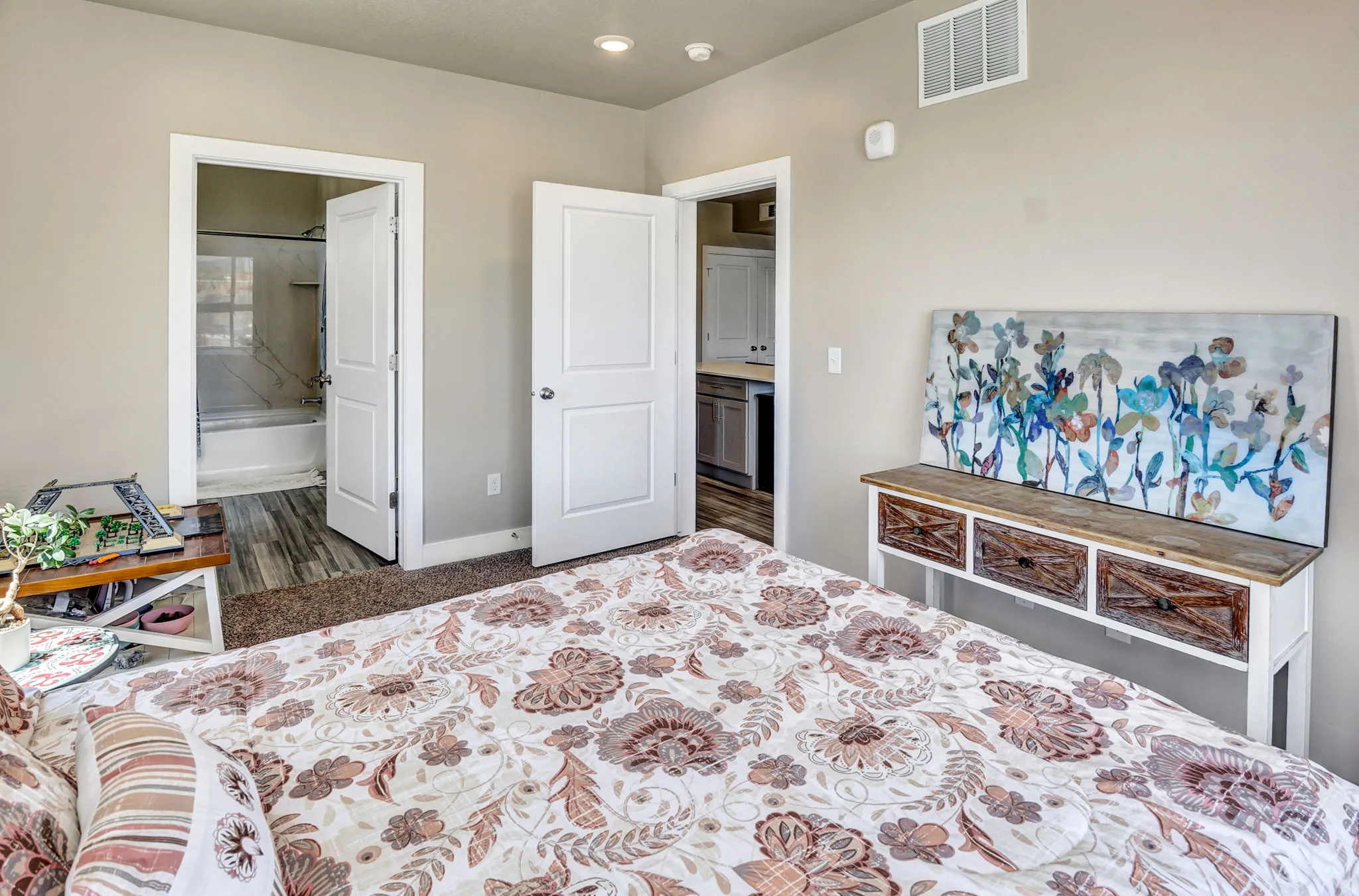 Carpeted room with neutral wall tones and white trim