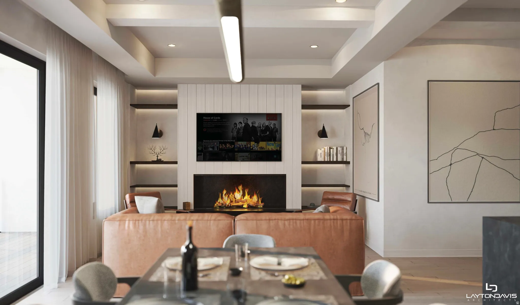 Living area featuring a contemporary fireplace with a sleek black surround, integrated shelving with accent lighting, and a tray ceiling with recessed lighting