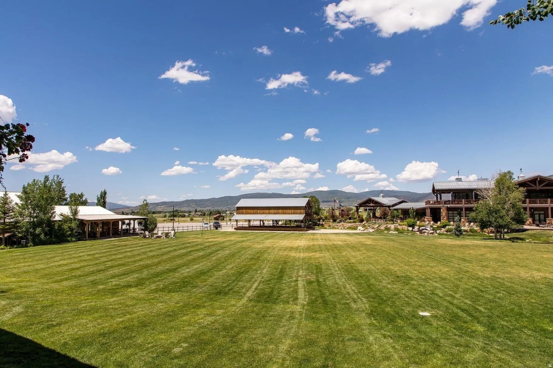 Expansive manicured lawn with mountain backdrop