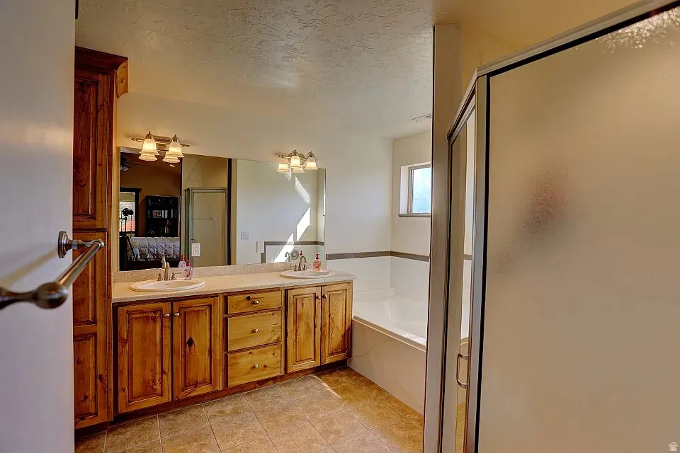 Dual vanity with wood-finish cabinetry and light-toned countertops