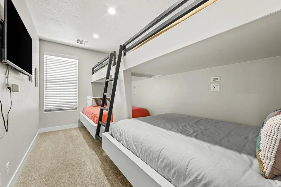 Built-in bunk beds featuring integrated ladders and individual lighting