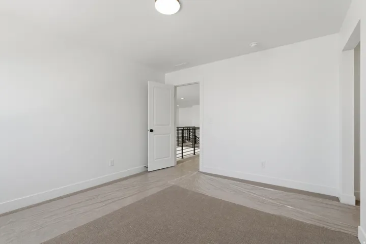 Room featuring neutral wall tones and a carpeted floor