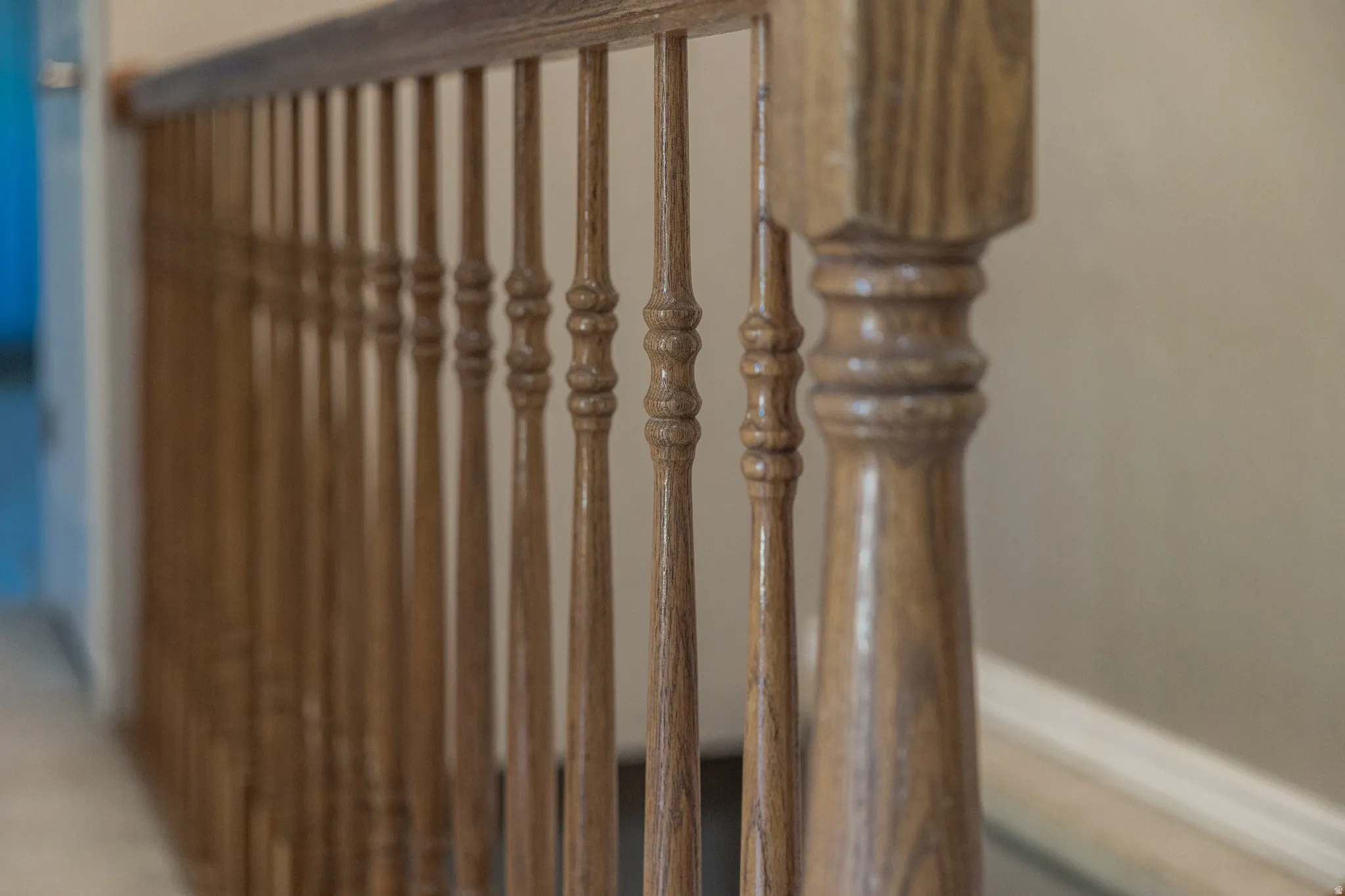 Hardwood railing with turned balusters and a polished finish