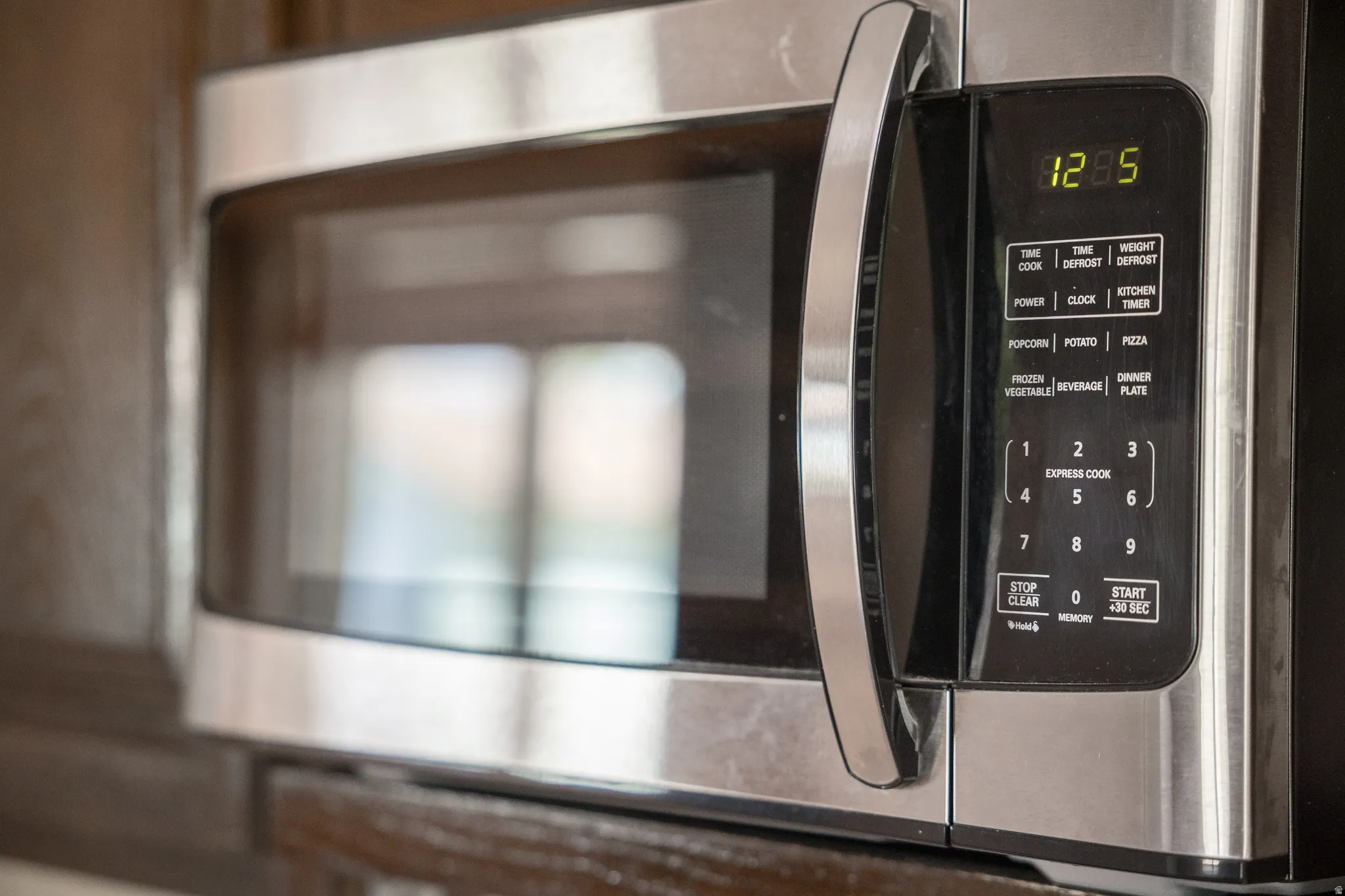 Stainless steel microwave with digital display and integrated control panel