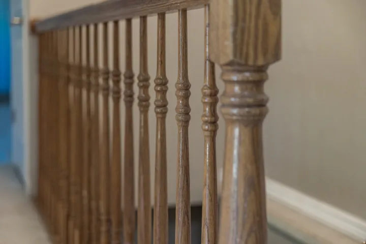 Hardwood railing with turned balusters and a polished finish