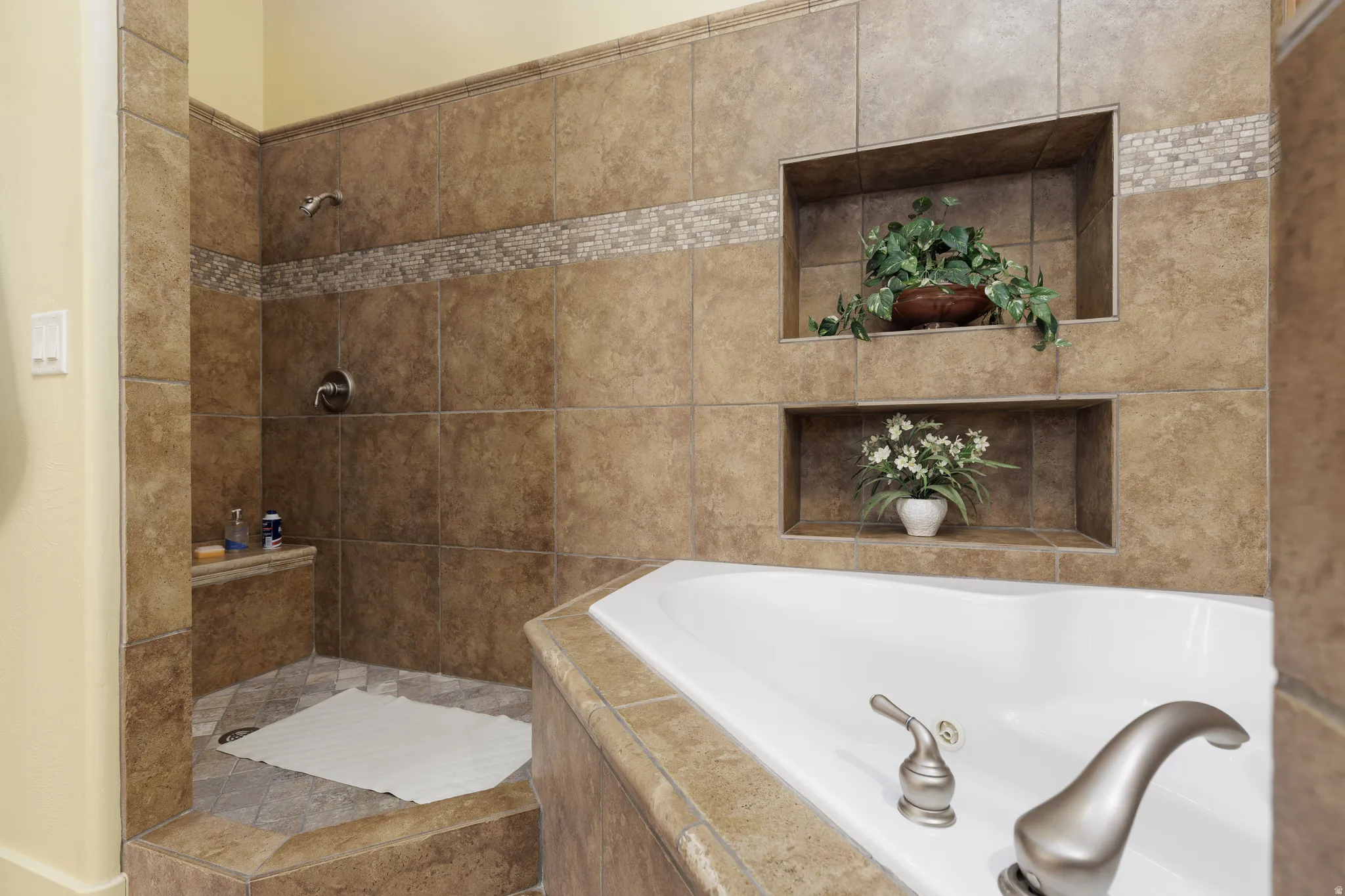 Corner garden tub with brushed nickel fixtures