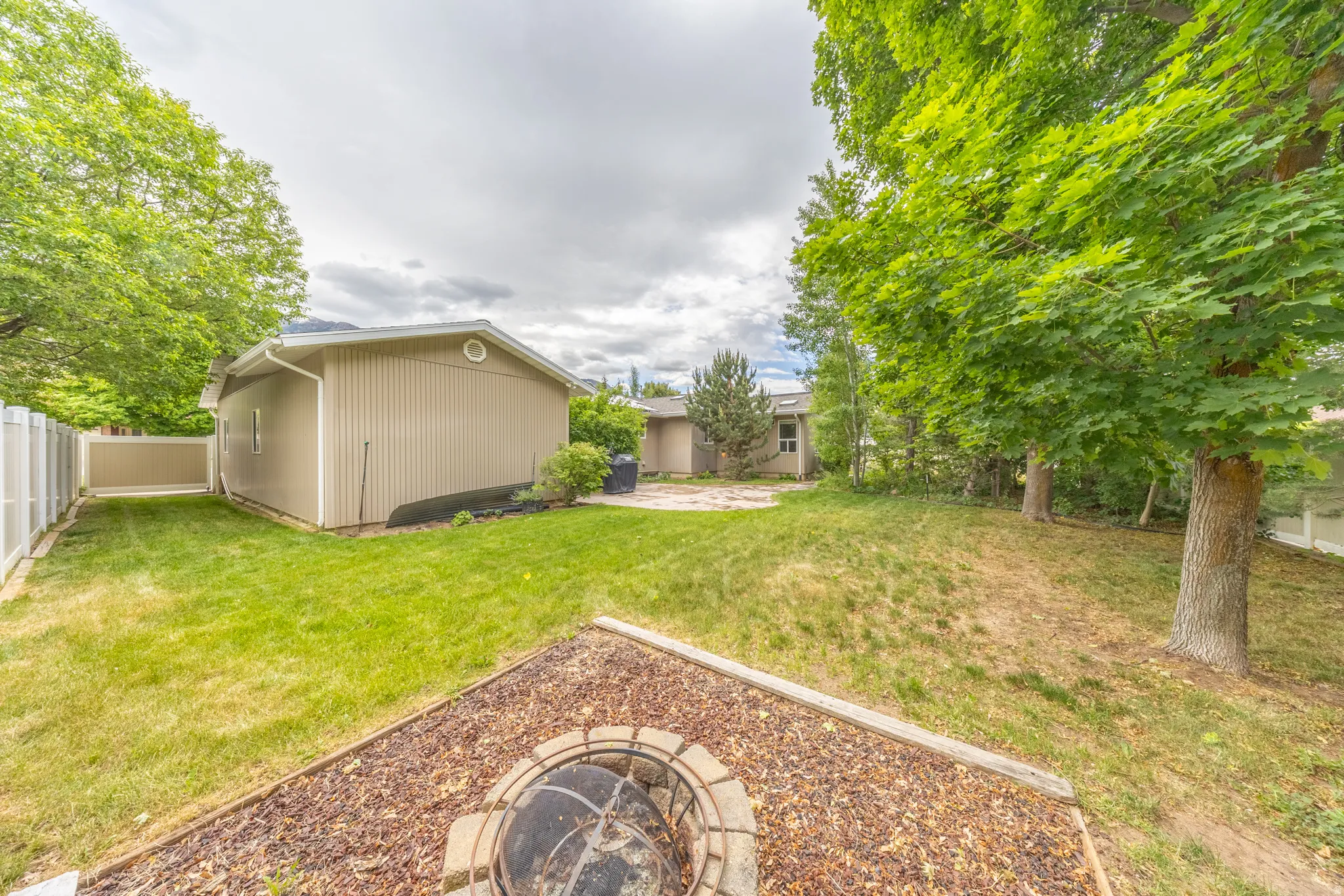 Backyard with firepit area and large patio