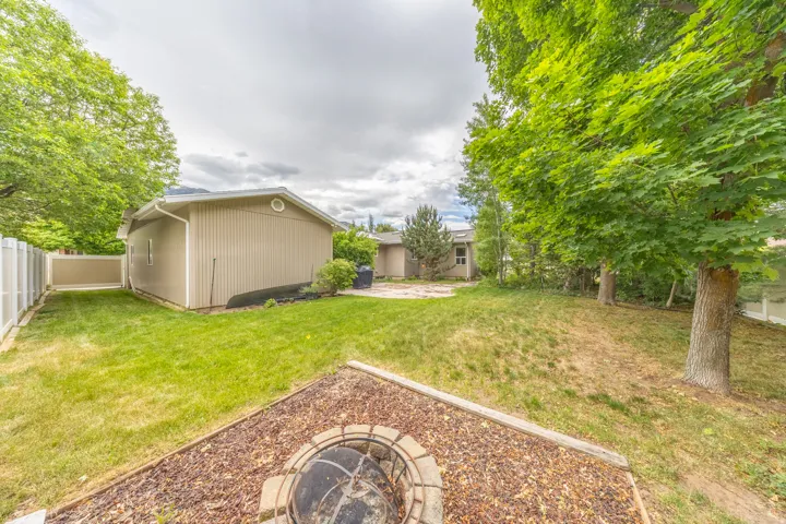 Backyard with firepit area and large patio