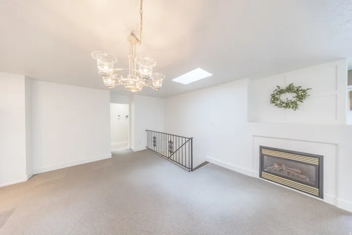 Dining room space with one of 3 fireplaces