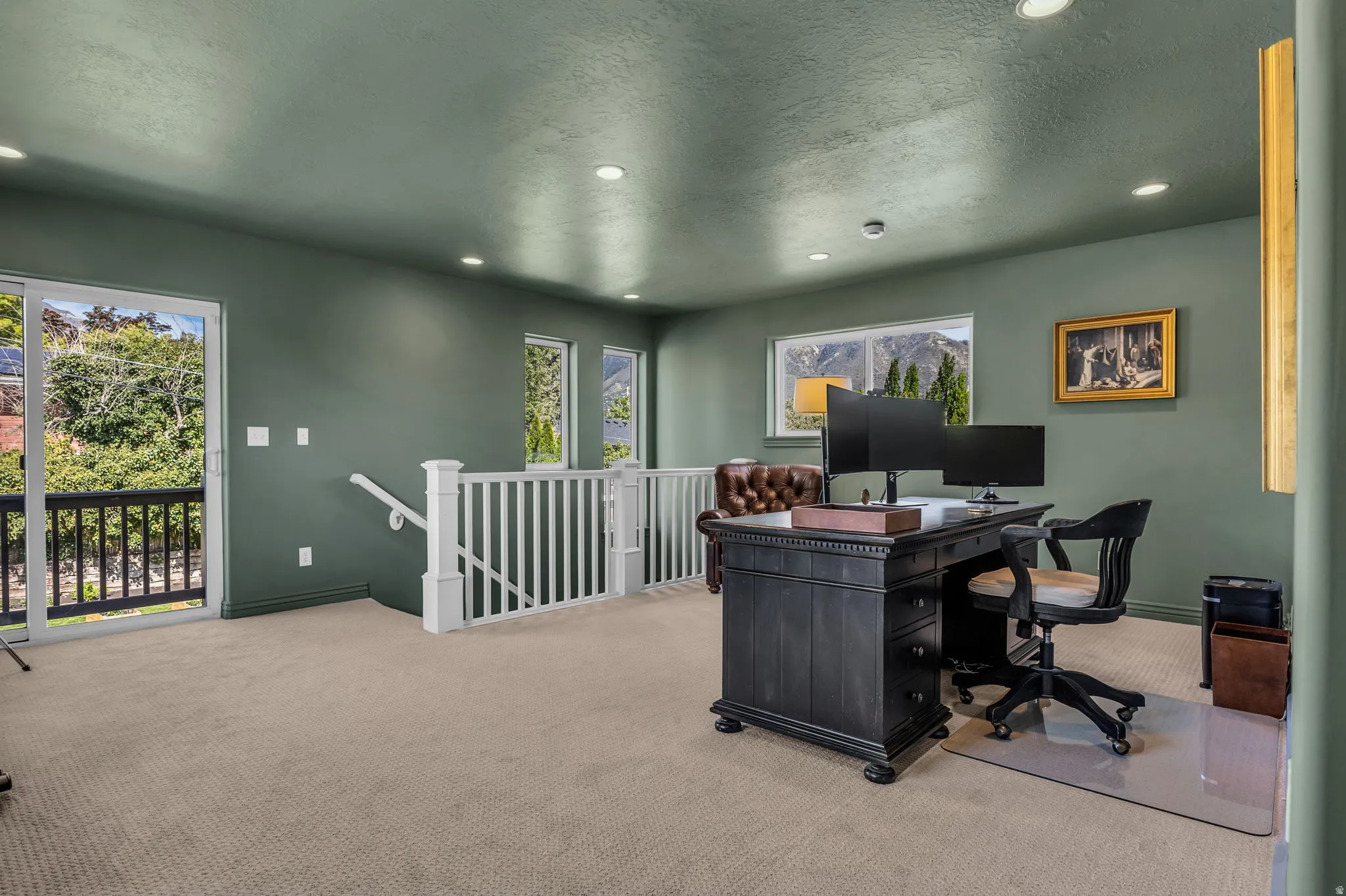 Light-filled office with balcony with views of Mount Olympus.