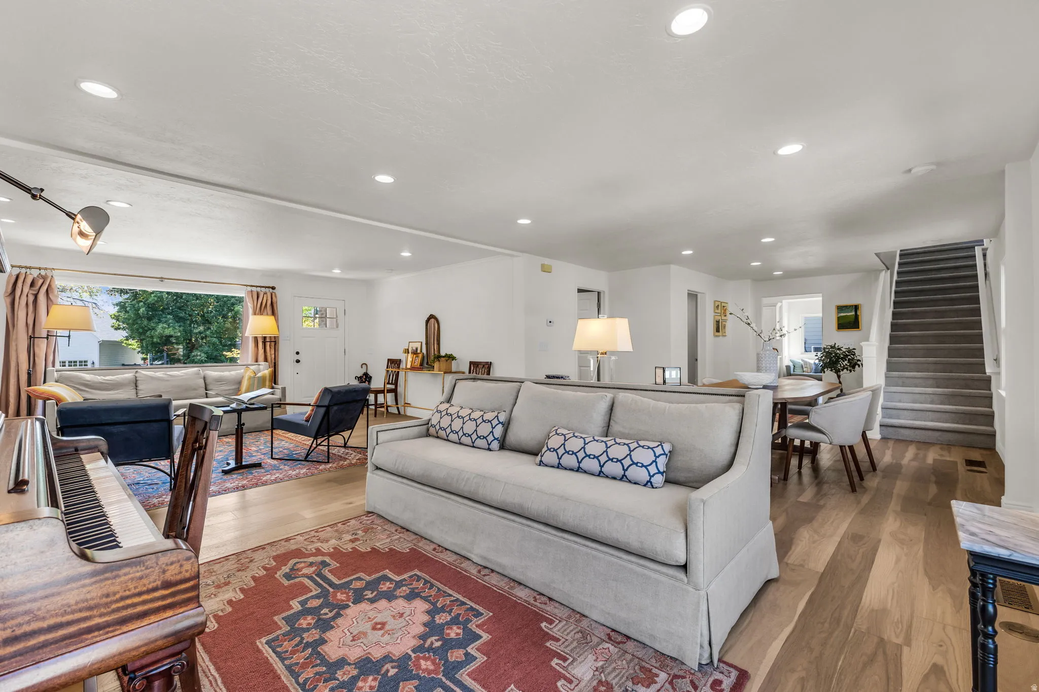 Spacious open-concept living room with natural light