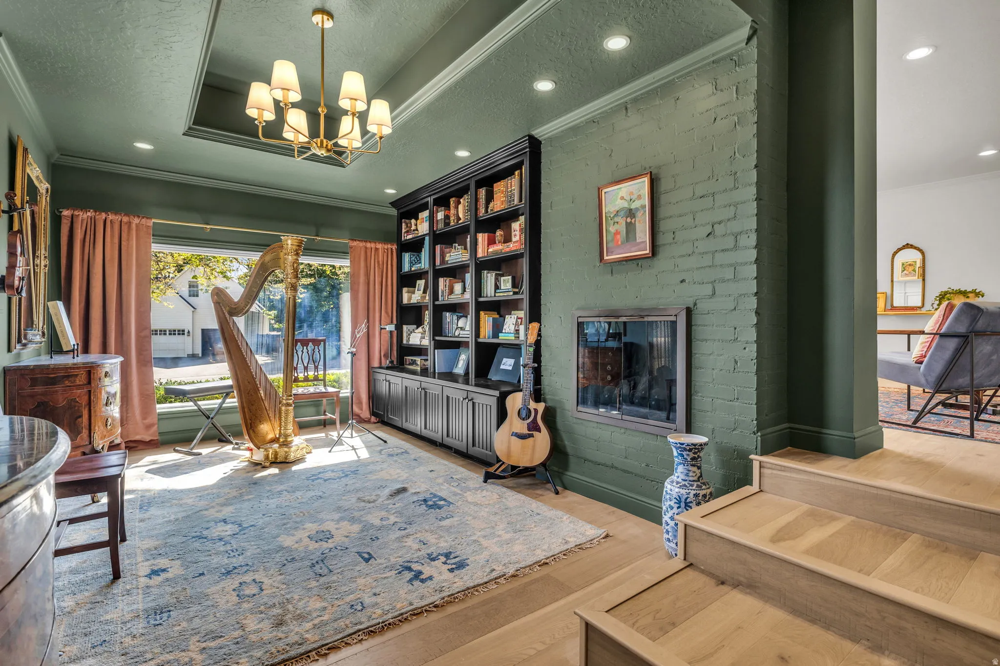 Music room with picture window & double-sided fireplace to living room