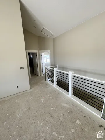 Modern horizontal baluster railing with white newel posts,