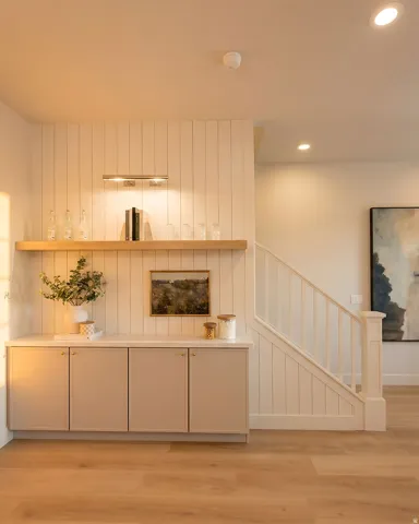 Built-in cabinetry with a light countertop and wood-finish flooring